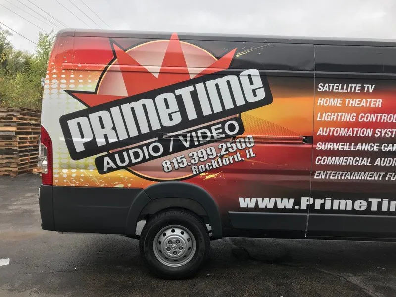 PrimeTime Audio/Video ProMaster — full side wrap with the flame-orange PrimeTime logo, service list, phone and website.