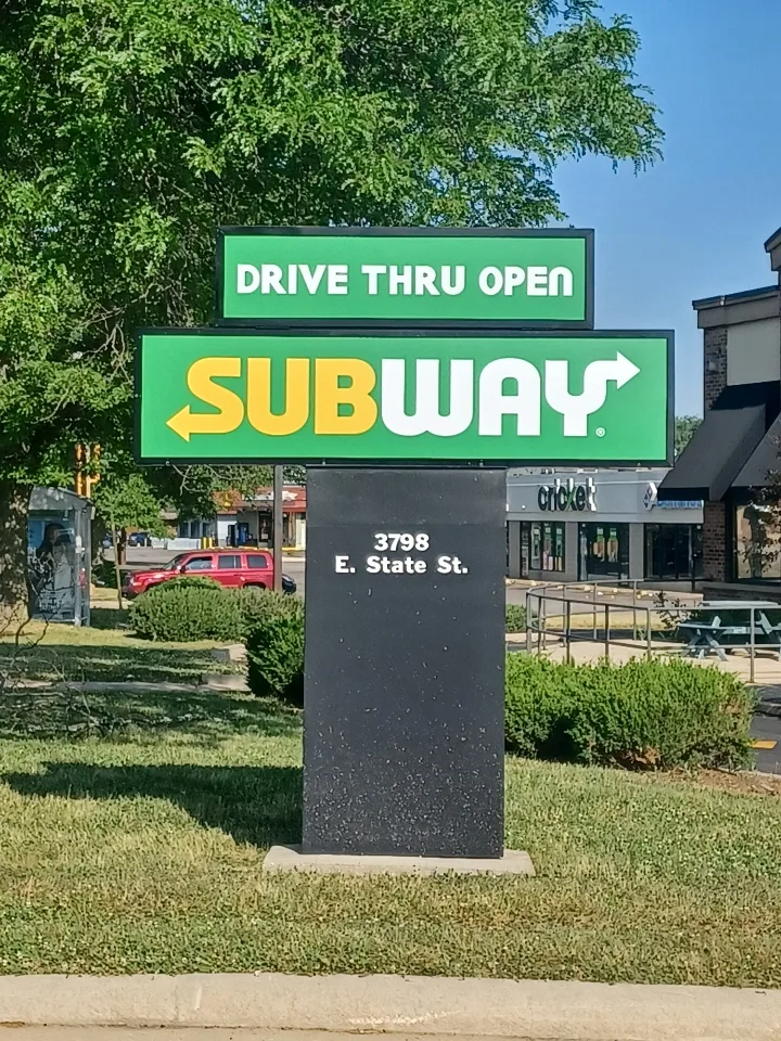 Subway drive-thru pylon sign — green branded cabinet with "DRIVE THRU OPEN" topper and dimensional monument base.
