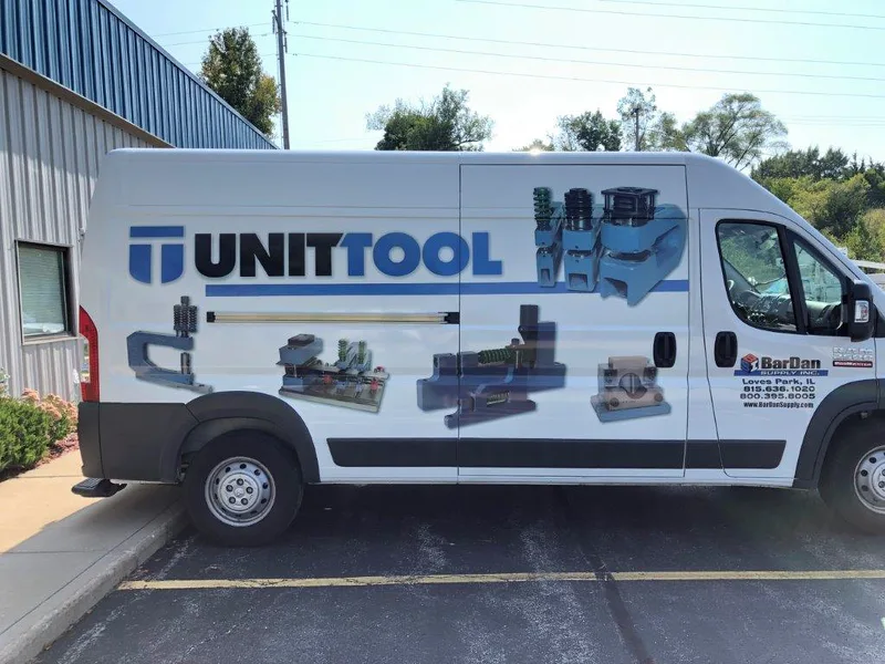 Unit Tool ProMaster van — blue UNITTOOL logo with product photography of tooling across the side panels.