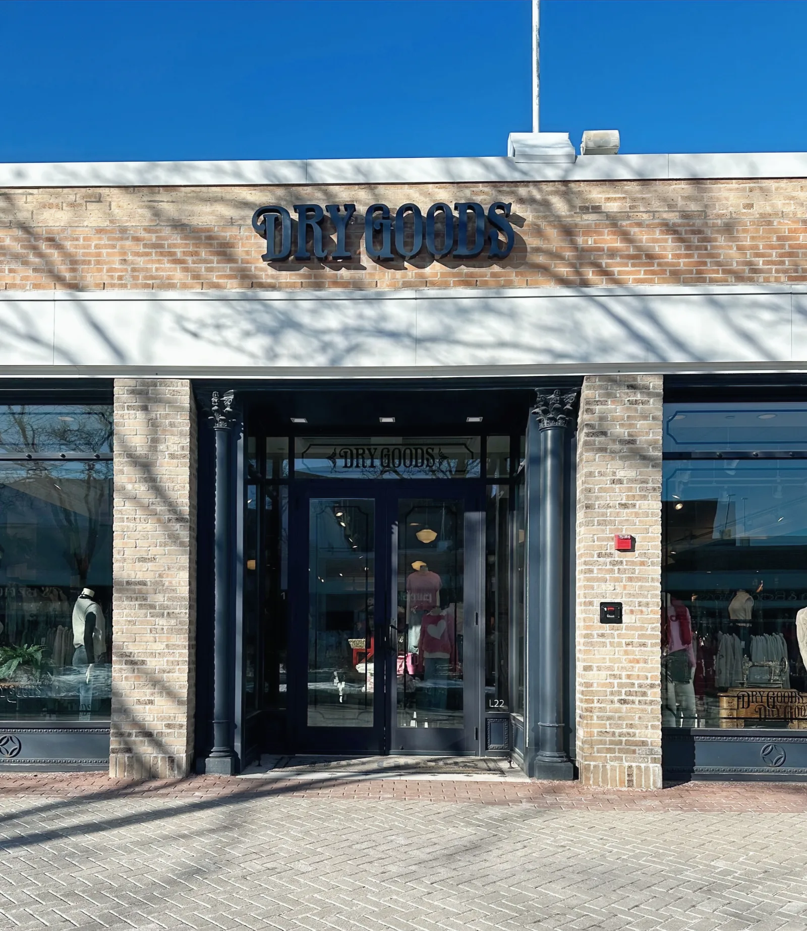 Dry Goods storefront with custom dimensional channel letters on a brick facade.